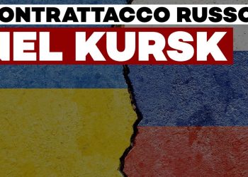 Muro con crepa centrale che divide le bandiere dipinte di Russia e Ucraina