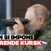 Vladimir Putin in tenuta militare guarda in un binocolo