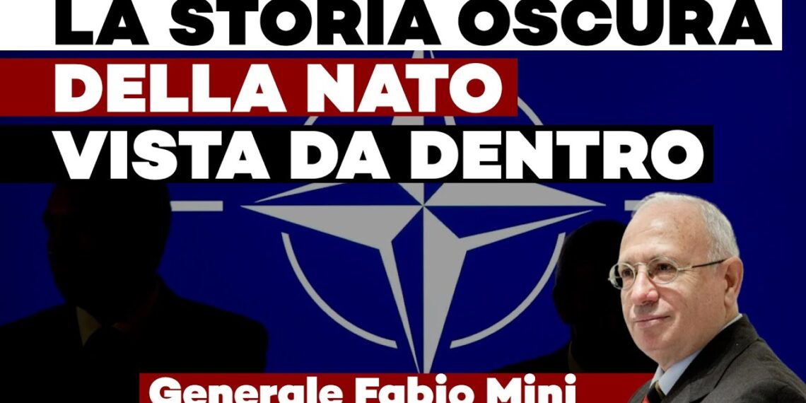 Simbolo della NATO con il generale Fabio Mini in primo piano