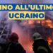Vigili del fuoco davanti a un palazzo in fiamme