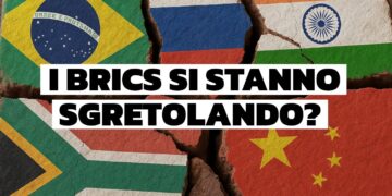 Muro sgretolato con le bandiere dei BRICS