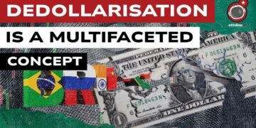 Banconota da un dollaro stracciata con il simbolo dei BRICS