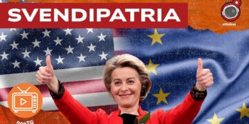 Ursula von der Leyen trionfante con alle spalle le bandiere di USA e Europa