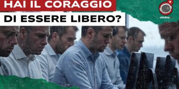 Impiegati con volti tesi davanti a monitor
