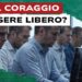 Impiegati con volti tesi davanti a monitor