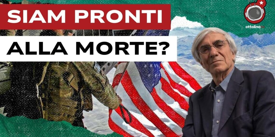 Militare con la bandiera americana. Angelo d'Orsi in primo piano