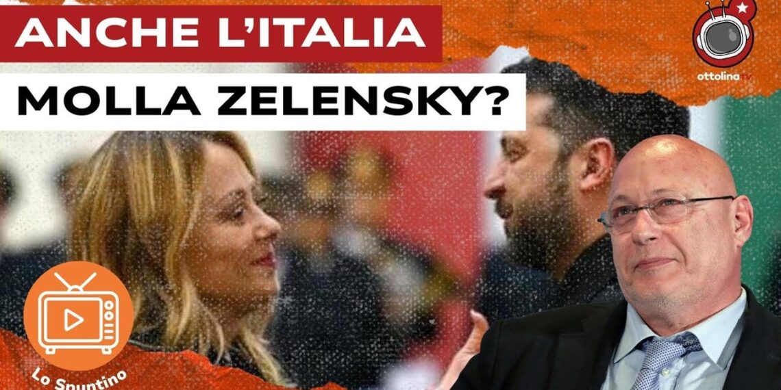 Giorgia Meloni e Volodymyr Zelensky si guardano con dolcezza. Gianandrea Gaiani in primo piano