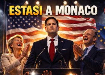 Bandiera USA sullo sfondo. Marco Rubio al centro con Ursula von der Leyen e Friedrich Merz che lo applaudono ai lati