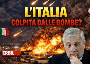Base NATO di Erbil in fiamme dopo l'attacco, con bandiera italiana. Antonio Tajani in primo piano