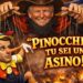 Donald Trump burattinaio regge i fili della marionetta di Emmanuel Macron vestito da Pinocchio