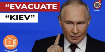 Vladimir Putin accigliato e con l'indice alzato