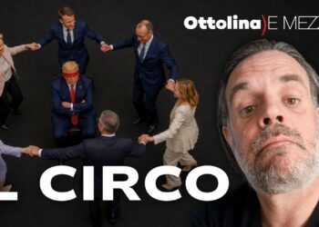 I leader europei fanno il girotondo attorno a Donald Trump seduto bendato. Giuliano Marrucci in primo piano