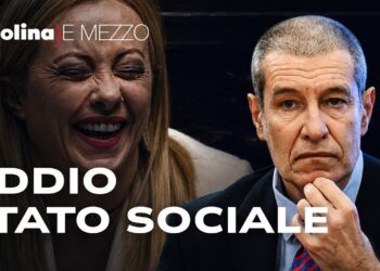 Giorgia Meloni che ride e Alessandro Volpi