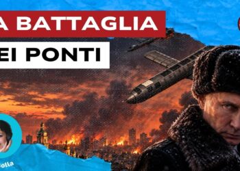 Droni si abbattono su Kiev in fiamme. Vladimir Putin accigliato in primo piano